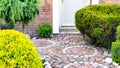 Original garden path with circular paving close-up. Pathway from brick paving stones made of red and white granite. Creative Royalty Free Stock Photo