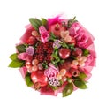 Original gift in the form of a bouquet consisting of roses, pomegranates, plums, grapes on a white background.