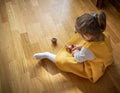 Little girl plays with the kendama