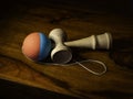 The original Kendama. Traditional, wooden Japanese skill toy for children. Has three cups, spike and ball, selective focus