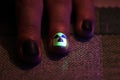 The original manicure in the form of a radioactive danger sign with gel shellac varnish, glows in the dark with