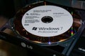 WILDFLECKEN, BAVARIA, GERMANY - JANUARY 11, 2020 An original Microsoft Windows 7 DVD in a DVD drive Royalty Free Stock Photo