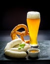 Original Munich sausage with Hefeweizen and pretzel Royalty Free Stock Photo
