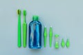 Original, orthodontic, interdental, angle interdental tooth brushes, mouthrinse and timer on gray background. Healthy lifestyle.