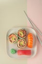 Original rolls with salmon and classic sushi with tuna on a plate