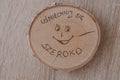 Original round mug coaster made of birch wood with a positive inscription in Polish