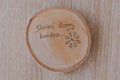 Original round mug coaster made of birch wood with a positive inscription in Polish