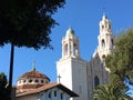 The original Mission San Francisco right adjacent to the newest Mission San Francisco, surrounded by palm trees, 1.