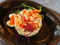 original serving of Russian salad with shrimps and red caviar. Royalty Free Stock Photo