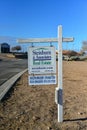 Original sign `Steinborn and Associates Real Estate` near road in New Mexico