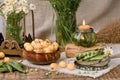 An original still life of Russia with the fire of a wax candle. Candle flame close-up. Rustic still life with white cherries, dais