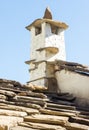 The original stone chimney on the roof of the cells of the Troyan Monastery, Bulgaria Royalty Free Stock Photo