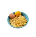 Original taste cereals or cornflakes with boiled egg and orange in blue ceramic bowl isolated on white background with clipping Royalty Free Stock Photo