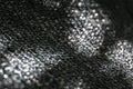 The original texture of the woven network or black nylon net with bokeh and sunlight spots