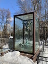 Moscow, Russia, March, 15, 2021. The original tombstone monument under a glass dome at the Vagankovsky cemetery in spring. Russia,