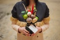 The original unusual edible vegetable and fruit bouquet with card in girl hands Royalty Free Stock Photo