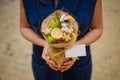 The original unusual edible vegetable and fruit bouquet with card in woman hands Royalty Free Stock Photo
