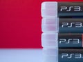 Original video games for the console Sony Playstation 3 on a red background. Royalty Free Stock Photo