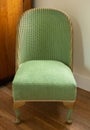 Original vintage deco green Lloyd Loom wicker rattan chair from the 1930s.