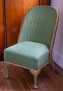 Original vintage deco green Lloyd Loom wicker rattan chair from the 1930s.