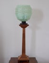 Original vintage deco green glass and wood lamp dating to the 1930s.