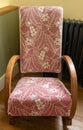 Original vintage upholstered wooden rocking chair dating to the 1930s.