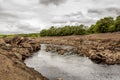 Earlstoun Loch, due to the draining Earlstoun Dam on the Galloway Hydro Scheme Royalty Free Stock Photo