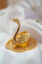 Original wedding rings on golden swan figure