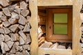 Original window in the woodpile, firewood for farming