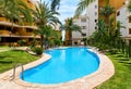 Orihuela, Spain- May 9, 2019: Idyllic place for vacationers residential high rise building house with swimming pool closed