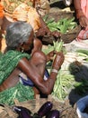 A Tribal woman sells fresh vegetables
