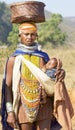 Orissan tribal woman carryng a baby