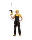 Orker handyman repairman or builder with construction tool - hammer drill percussion perforator