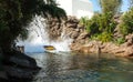 A boat splashes on the Jurassic Park water ride