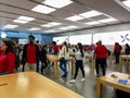 An Apple store with people waiting to purchase Apple Macbooks, iPads and iPhones Royalty Free Stock Photo