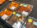 A display of ready to bake chicken dinners at a Whole Foods Market grocery store waiting for customers to purchase