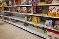 Empty grocery store shelves of cereal before a hurricane or snow storm