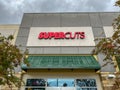 The exterior sign above a Supercuts hair salon storefront in Orlando, Florida Royalty Free Stock Photo