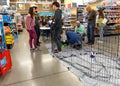 A family looks at adopting a puppy at a Petsmart pet superstore