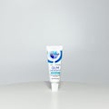 A tube of Crest ProHealth Gum Detoxify toothpaste on a white background