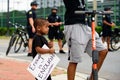 Orlando, FL, USA - JUNE 19, 2020: Black boy with a poster in protest Black Lives Matter. Cute child and protest. Royalty Free Stock Photo