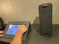 A man playing with the Sonos speaker display at an IKEA store Royalty Free Stock Photo