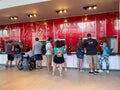 People pouring soda from a sample soda fountain Royalty Free Stock Photo