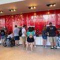 People pouring soda from a sample soda fountain Royalty Free Stock Photo