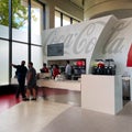 People purchasing soda from an international  Coca Cola soda fountain Royalty Free Stock Photo