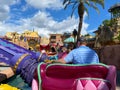 People riding the Aladdin Magic Carpet ride at Disney World