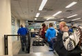 People waiting in line to go through Orlando International Airport MCO TSA security Royalty Free Stock Photo