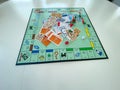 Pieces for the game Monopoly by Hasbro on a white background.  Concept business Royalty Free Stock Photo