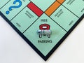 The race car on the Free Parking square for the game Monopoly by Hasbro on a white background