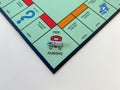 The race car on the Free Parking square for the game Monopoly by Hasbro on a white background